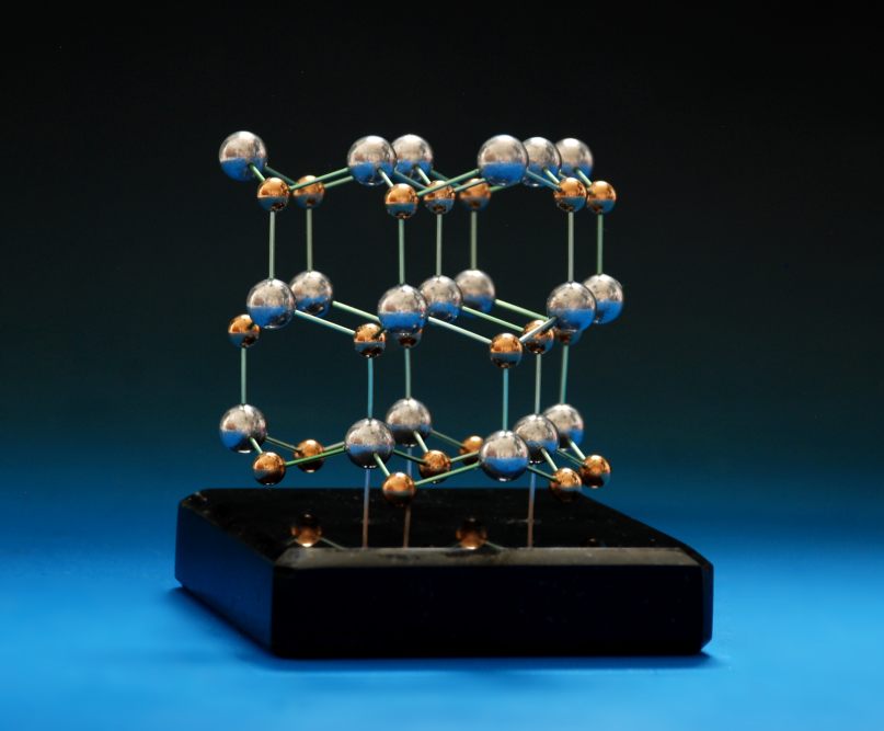 Crystal structure model of GaN made with brass and aluminium balls on a granite base
