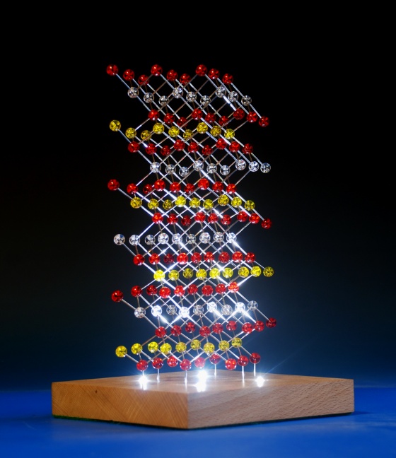 illuminated molecular model of Lithium cobalt oxide on a wood base with integral lighting