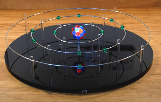 Illuminated model of an atom