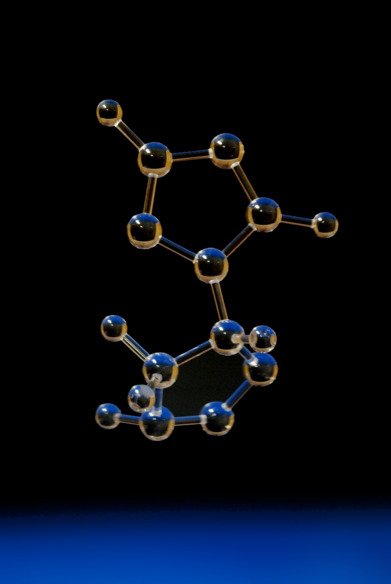 A clear transparent molecular model made with acrylic balls and rods
