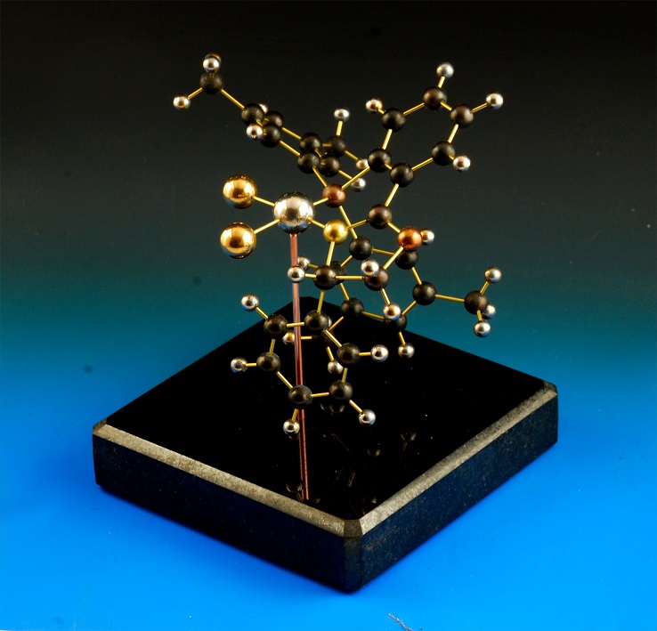 Brass copper and stainless steel molecular model on a granite base