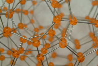 A detailed view of a model of 533 polytope made with acrylic balls and steel rods