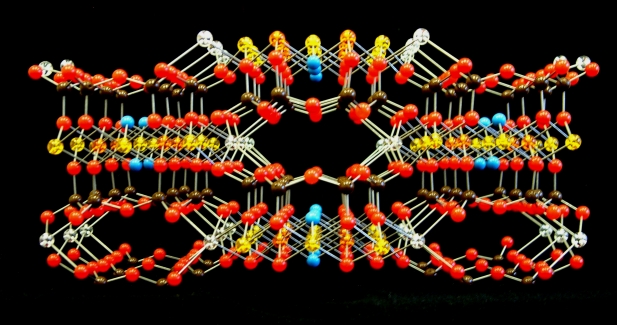 A crystal structure model of the amphibole mineral Riebeckite, looking into the channels